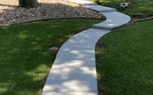 Curved-Concrete-Walkway-to-Back-Door